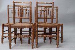 A (harlequin) set of six 19th Century spindle back chairs having solid elm seats , triple spindle to
