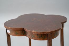 A 19th Century occasional table having shaped top and undertier, both having transfer decoration, on