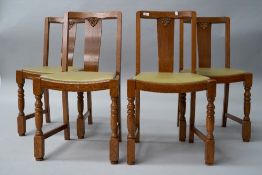 A set of four mid 20th Century oak and ply dining chairs, havingbent ply backs, lime green vinyl