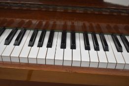 A modern upright piano , inlaid Zender, in polished mahogany case being overstrung, width approx.
