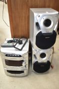 A Panasonic CD Stereo System , with 5 CD changer and twin cassette decks, model SA-AK18, includes