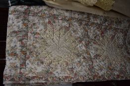 A retro cotton patchwork quilt having floral fabrics and style design double in size