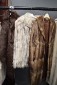 A selection of fur coats and a stole including fox