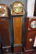 A lang cased grandmother clock having ormalu style decoration with gilt detail case