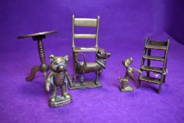 A selection of brass wares including miniature model chair