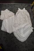 A collection of antique aprons and petticoats having cut and lace work