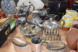 A selection of plated wares including Victorian part tea set and dress brushes
