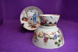 A New Hall tea bowl and saucer depicting scenes of child catchi
