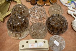 A selection of glass and ceramic rose or flower holders