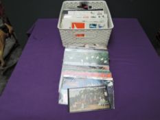 A collection of Royal Mail FDC and Presentation Packs, two World Stanp Albums and loose Stamps