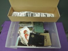 A collection of vintage Postcards including two albums of India and loose Real Photo's and