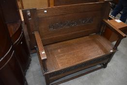 A traditional oak monks bench