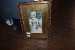 A Victorian picture frame having carved edge detail with period print