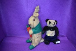 Two early 20th century child toy bears including a panda and rabbit with carrot