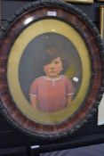 An original mixed media artwork of a young child in an ornate oval frame