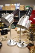 A pair of mid century polished steel side or table lamps