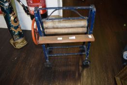 A possible Triang Toy Mangle having blue frame and red turning wheel