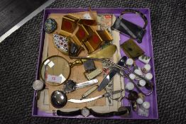 A selection of curios and trinkets including pocket knives