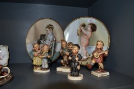 Two figure studies by Hummel and two ceramic display plates