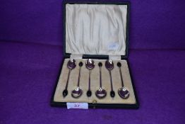 A cased set of six HM silver tea spoons in an art deco design