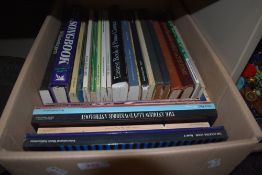 A selection of various music books and sheet music for piano