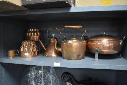 Two antique copper jelly moulds, two stove top copper kettles and a copper serving dish etc