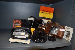 A selection of vintage cameras and accessories,binoculars and book also included.