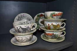 A selection of tea cups and saucers by Crown Devon Fieldings depicting country cottage scenes