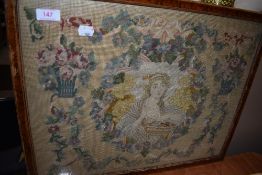 An early Victorian embroidery and needlework depicting a seated woman