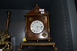 A mantle or bracket clock having mahogany case with ormolu decoration and enamel face