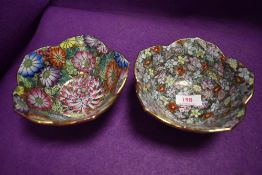 A pair of Chinese hard paste lotus form bowls with millefiori design