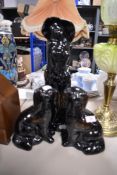 A pair of dog figures and a similar figure study