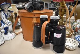 A pair of Daylite deluxe 10x50 binoculars and a similar pair