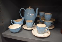 A part tea service in a blue ground with star design by Alfred Meakin in the Morning star design