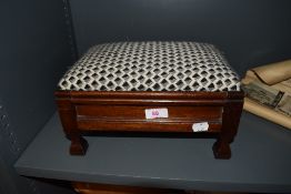 A small mahogany framed foot stool