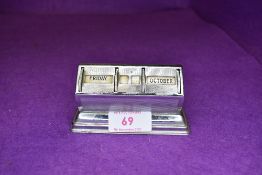 An art deco desktop perpetual calendar having machine tooled chrome case