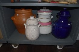 A selection of large ceramic buscuit jar and similar grain and flour containers