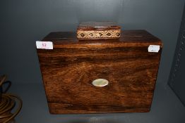 A sewing box having mother of pearl inlay possibly from coromandel wood and a similar smaller case