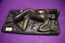 A min century studio pottery plaque of a nude man