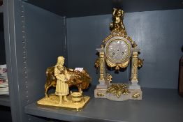 A ceramic figure study by Eichwald and a stone and ormolu mantle clock