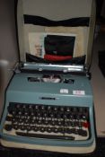 A vintage Olivetti Lettera 32 typewriter with case and accessories