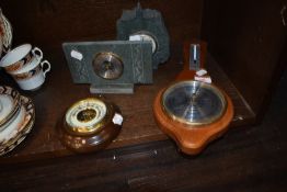 Four vintage barometers including slate mantel examples.