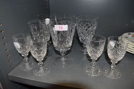 A selection of clear cut crystal glass wares including four Thomas Webb sherry glasses