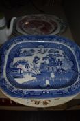 Four large ceramic charger plates inclduing Willow wear