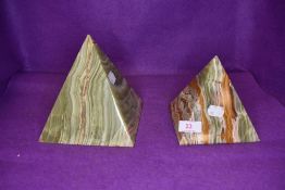 Two green onyx stone cut pyramids