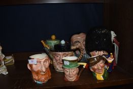 A selection of character Toby style jugs and cups including Royal Doulton and Beswick