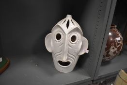 A ceramic lamp base in the form of a grotesque figure head or mask marked Italy to base