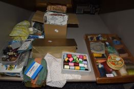 An assortment of vintage haberdashery including buttons,buckles,thread and more.