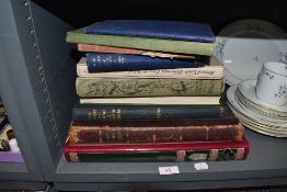 A selection of text reference and library books including the Grammar of Ornament and wind in the