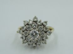 A diamond multi stone cluster ring, total approx 1ct in a stepped claw set basket mount to split